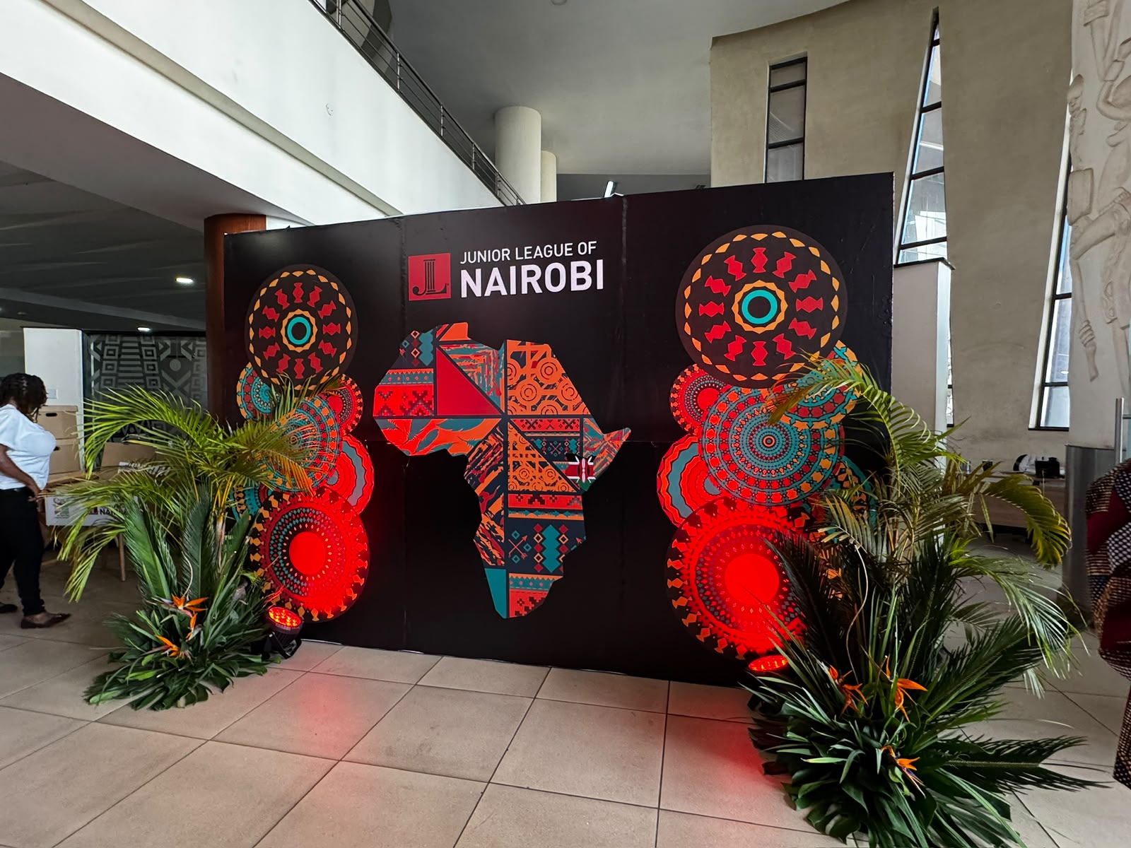 Event backdrop featuring an illustrated map of Africa flanked by glowing patterned medallions